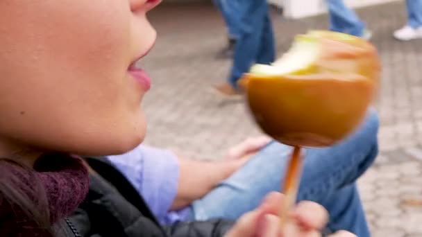 Close Woman Eating Candy Toffee Apple — Vídeos de Stock