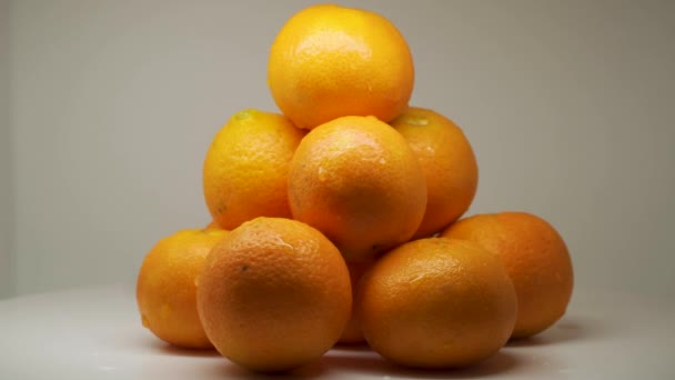Beautiful Piles Juicy Orange Fruits Rotating Spinning White Background Close – stockvideo