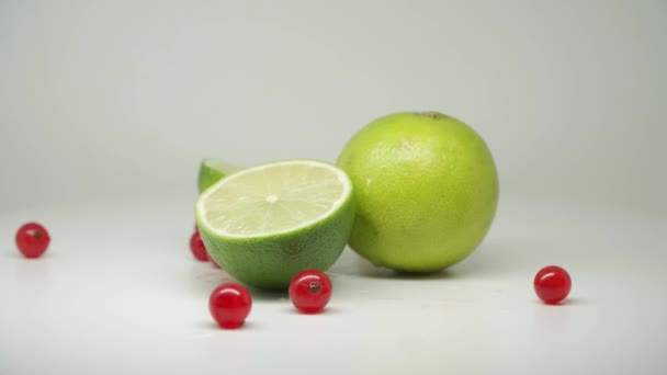 Fresh Green Lime One Sliced Horizontally Red Currants Close Shot — Stockvideo