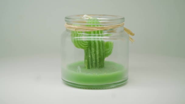 Green Cactus Wax Candle Clear Jar Slowly Moving Circular Motion — Stock video