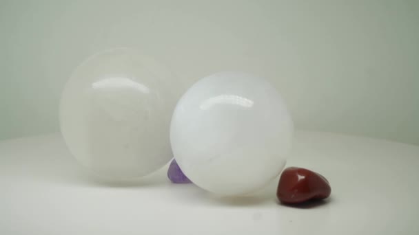 Two Crystal Balls Different Sizes Purple Red Gem Stones Interconnected — Vídeo de Stock