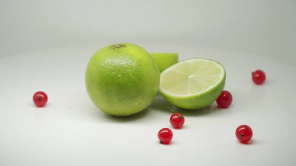 Fresh Green Limes Red Currants All White Table Close Shot — Stok video