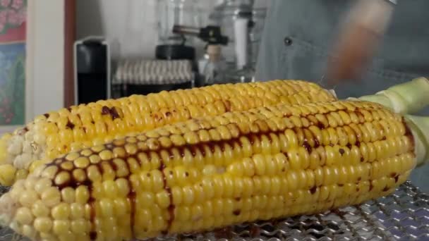 Japanese Female Chef Puts Shoyu Soy Sauce Grilled Corn Her — Vídeo de stock