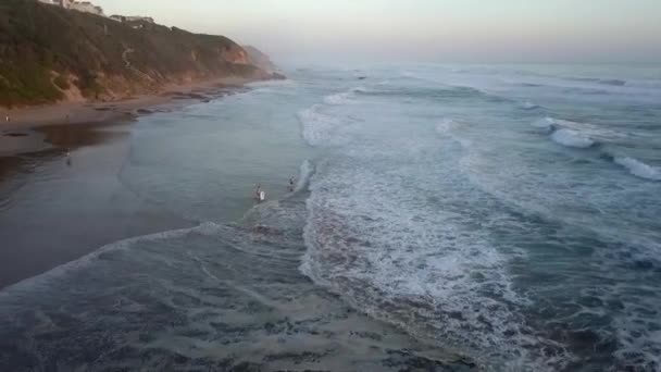 Two Boys Boogie Board Play Beach Waves Evening Light Aerial — Vídeo de Stock