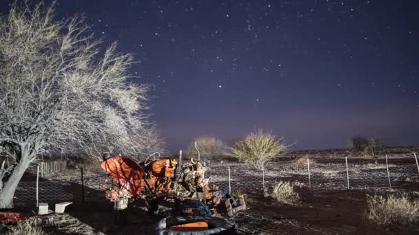 Timelapse Night Stars Moving Background Old Broken Tractor Foreground Namibia — Stockvideo