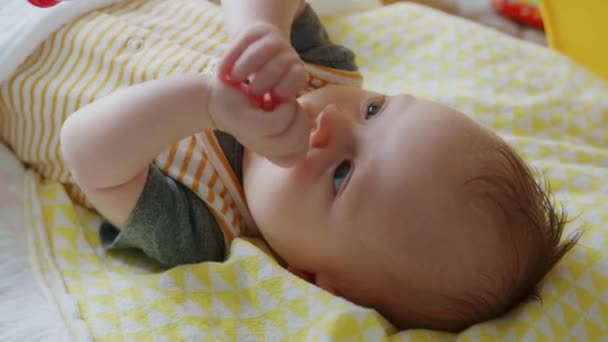 Cute Baby Plays Hands Laughs Makes Faces While Lying Ground — 비디오