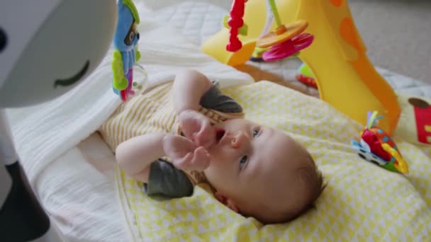 Adorable Blue Eyed Eight Week Old Baby Smiles While Playing — Stockvideo