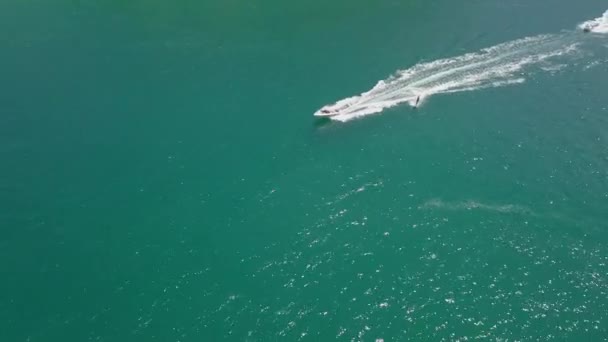 Tracking Aerial Surfer Waterskiing Beautiful Jade Colored Water — Stock video