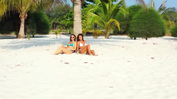 Two Beautiful Ladies Relaxing Calm Exotic Beach White Sand Backed — Videoclip de stoc