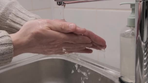 Man Washing Her Hands Liquid Soap Bathroom — стоковое видео