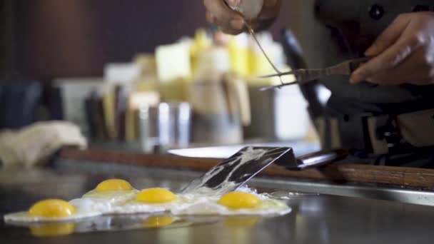 Chef Cracks Egg Steel Spatula Make Them Slide Hot Plate — Stockvideo