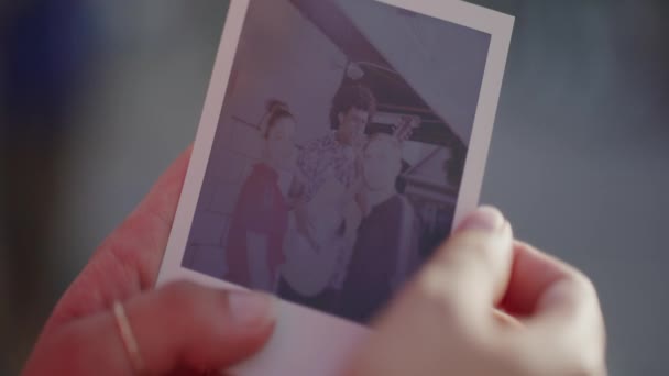 Woman Holds Polaroid Picture Friends Slow Motion Close — Stock Video