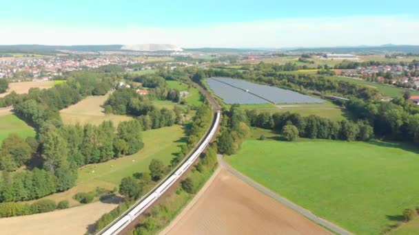 Commuter Train Passes Landscape Farmland — Vídeo de stock