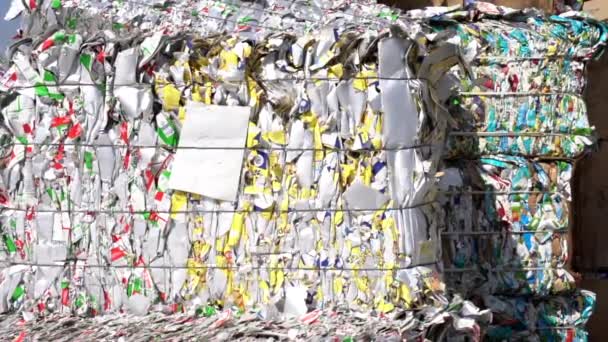 Cinematic Shot Bales Flattened Yellow Red Milk Cartons Ready Recycling — Stock Video