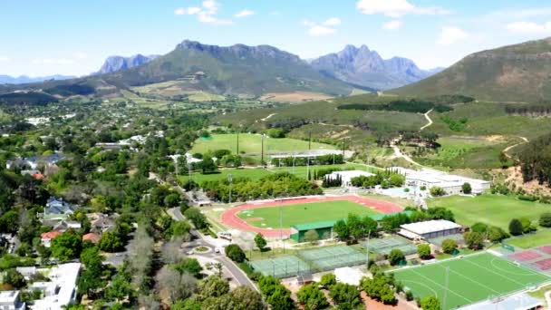 Aerial Drone Rotating University College Sports Athletics Stadium Track Field — Vídeo de Stock