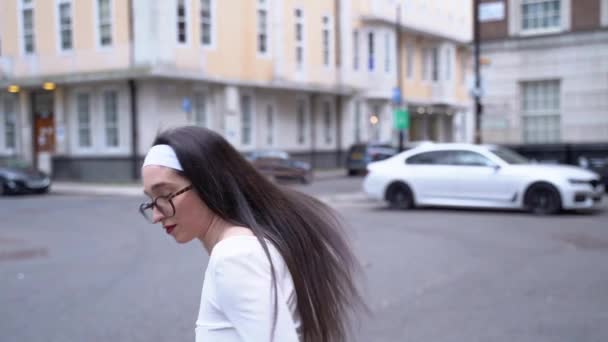 Young Woman Turns Hair Flips Smiles Soho London Close Slow — стоковое видео