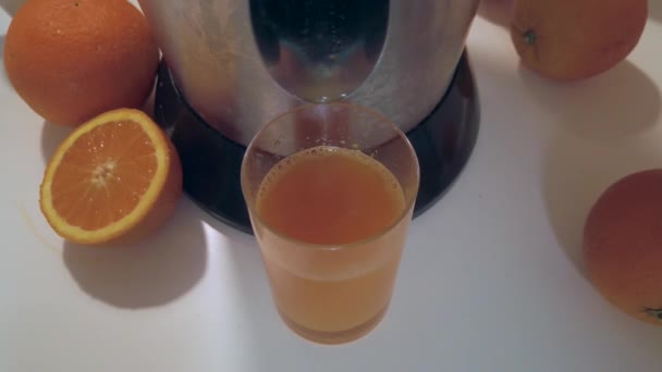 Orange Juice Pouring Glass White Table Citrus Juice Slow Motion — Stock Video