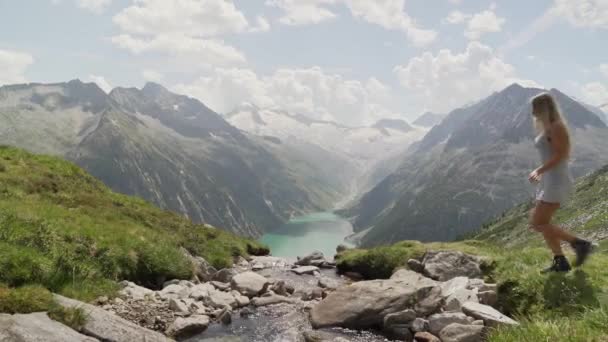 Girl White Dress Jumps Little Stream Right Left Scenery Looks — Stock Video