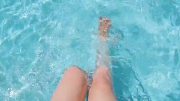 Female Sitting Poolside Splashing Water Legs Clear Crystal Water Slow — Video