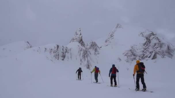 Backcountry Skiers Heading Jagged Rocky Spire — Stock Video