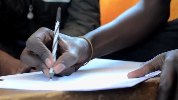 Close Hand Young Man Writing Seminar Kibera Nairobi Kenya — Vídeos de Stock