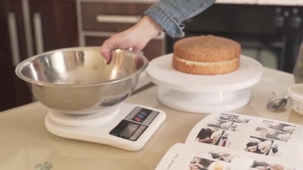 Girl Puts Large Silver Bowl Kitchen Scale She Presses Buttons — Stock Video