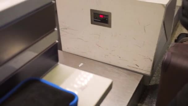 Young Man Lifts His Luggage Airport Scale Check Counter — Stockvideo