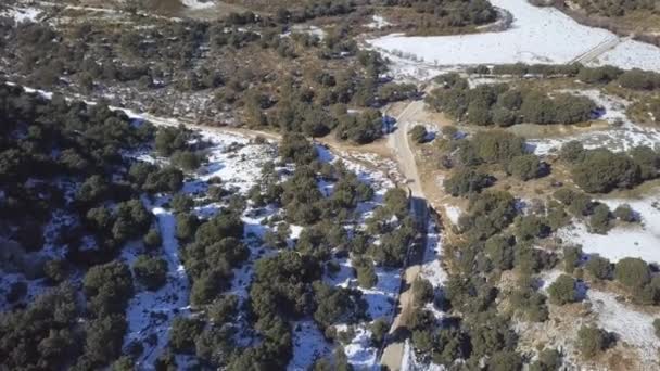 Aerial Shot Car Driving Road Surrounded Snowed Pines Spain — стокове відео