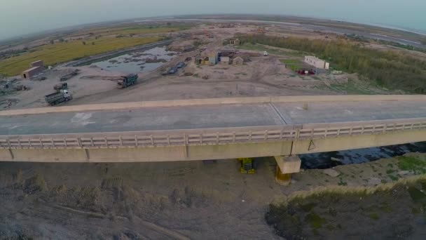 Aerial View Constructed Bridge River Heavy Duty Trucks Machinery Farms — Video Stock