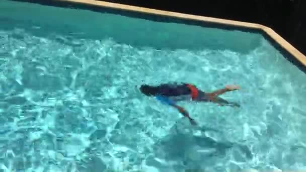 Young Boy Propels Himself Forward Butterfly Stroke Underwater Right Left — Vídeo de stock