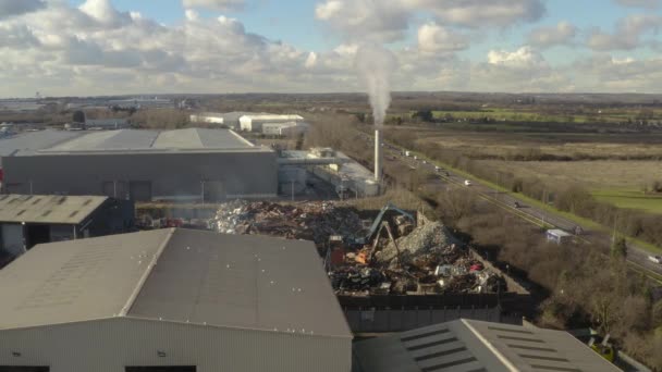 Aerial Drone Shot Smoking Chimney Scrap Metal Factory Moving Left — ストック動画
