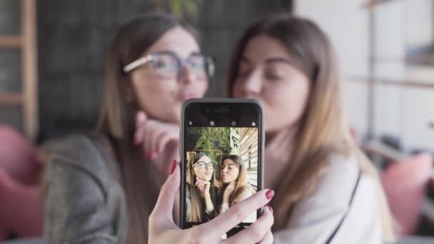 Two Female Friends Take Funny Selfies Phone Cafe — Vídeos de Stock
