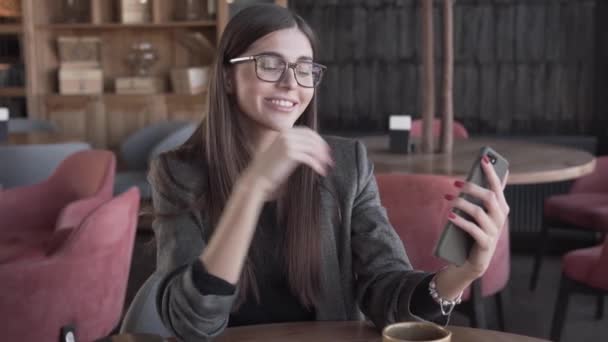 Beautiful Girl Glasses Sitting Cafe Using Her Smartphone Taking Funny — Stockvideo