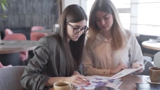 Two Smart Presentable Ladies Who Groupmates Work Together Mutual Project — стоковое видео