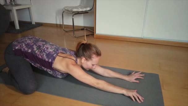 Woman Home Stretches Lowers Herself Yoga Pose Her Mat Raises — Stock Video