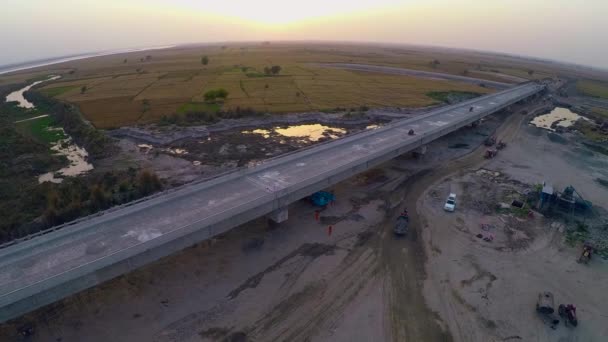 Aerial View Constructed Bridge River Heavy Duty Trucks Machinery Farms — Stok Video