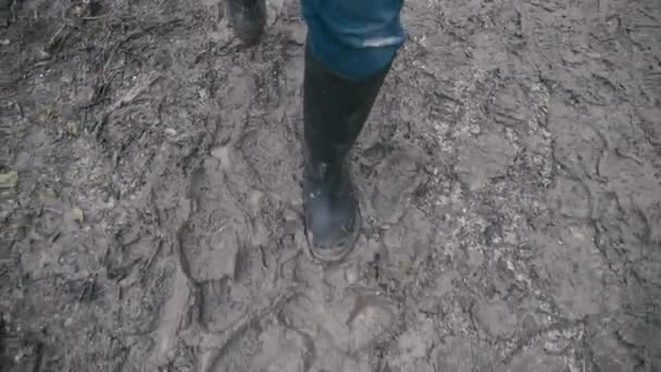 Muddy Boots Walking Muddy Path Slow Motion — Vídeo de stock