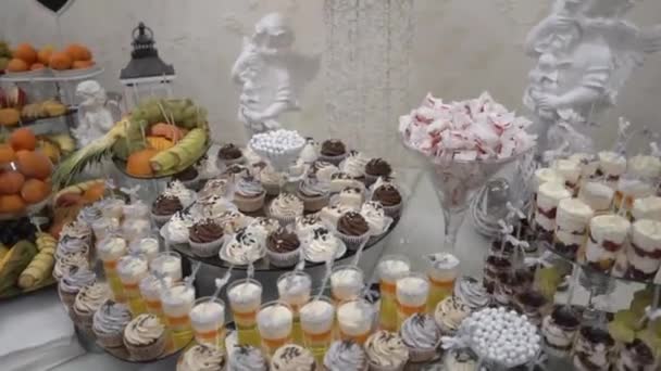 Very Beautiful Rich Sweet Buffet Decorated Angel Statues Lanterns Back — Stockvideo