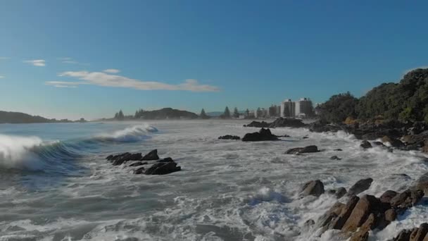 Aerial Slow Motion Waves Breaking Rocks Mount Maunganui Beach New — Stockvideo