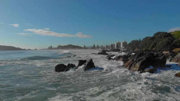 Aerial Slow Motion Waves Breaking Rocks Clip Mount Maunganui Beach — Stockvideo