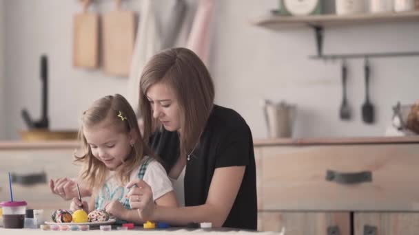 Daughter Sitting Her Mum Lap Table Painting Easter Eggs Gouache — Video Stock