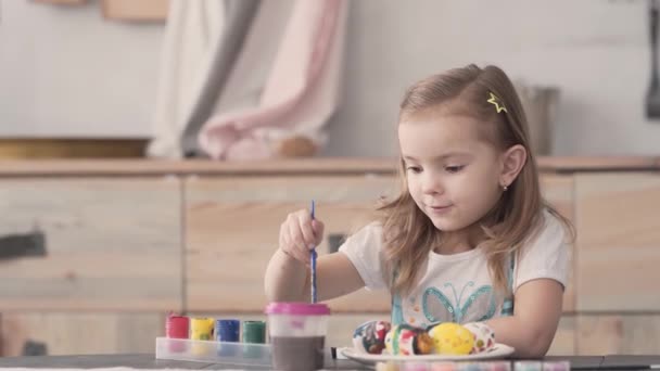 Cute Little Girl Painting Eggs Brush Different Colours Paints Easter — 图库视频影像