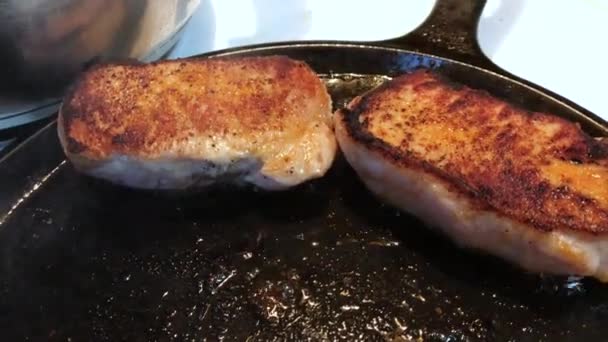 Closeup Delicious Looking Pork Chops Frying Cast Iron Pan High — Video