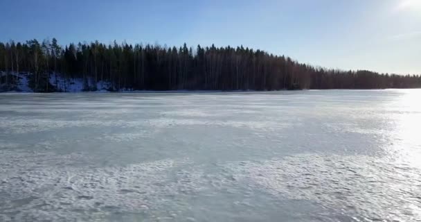 Aerial Sideways Low Sunshine Reflected Frozen Winter Ice Lake — ストック動画