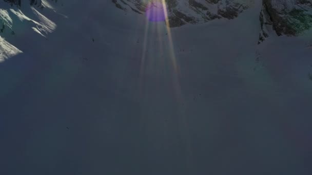Pan Reveal Snow Covered Mountain Ridge Sun Sun Flare French — Stock videók