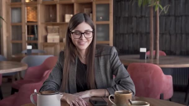 Beautiful Young Woman Glasses Smart Suit Sitting Cafe Turning Music — 비디오