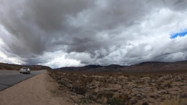 Time Lapse Dark Storm Clouds Rolling Mojave Desert Mountains Road — Stock Video