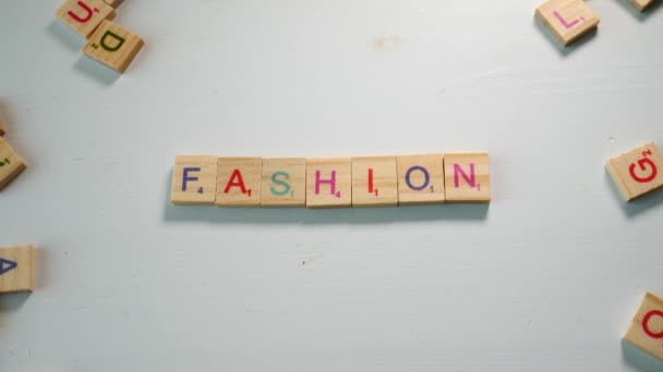 Someone Spelling Fashion Wooden Letters White Background Other Scattered Letters — ストック動画
