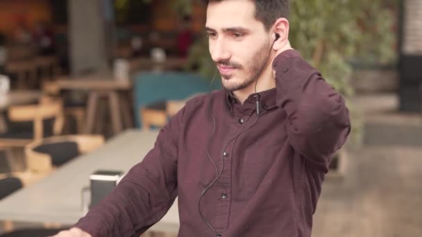 Young Man Beard Mustaches Sitting Cafe Earphones Typing Laptop Front — Stok Video