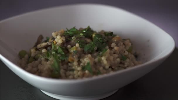Rotating Steamy Plate Vegetarian Couscous — Stockvideo